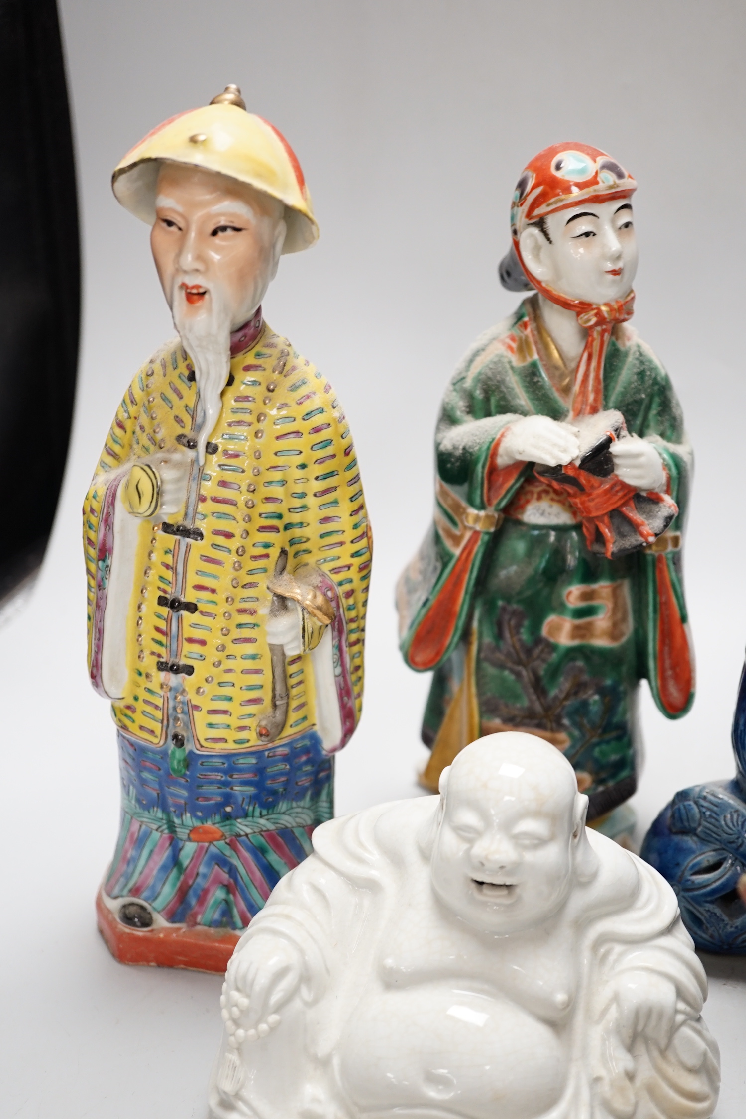 A group of assorted Chinese and Japanese pottery and porcelain figures, 19th/20th century, tallest 26cm high